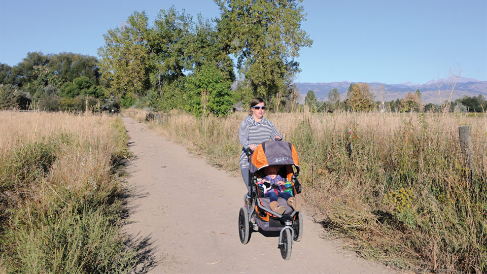 Mother jogging with stroller