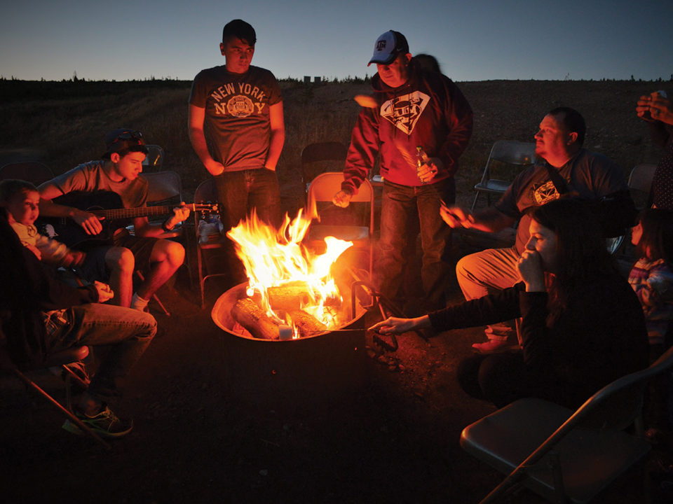 Military families around a campfire