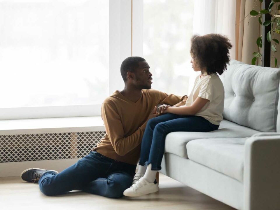 Father talking to daughter