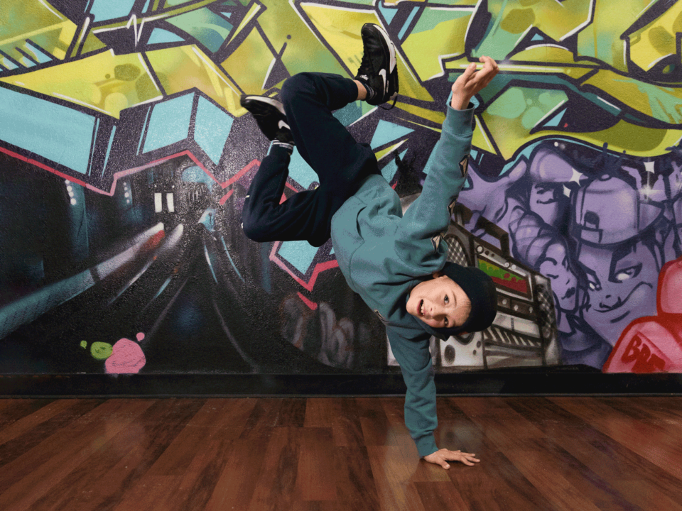 Boy breakdancing in studio