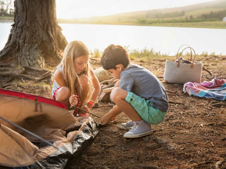 Children setting up a tent